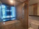 Modern bathroom interior with glass shower and large window