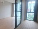 Spacious and bright unfurnished living room with large windows