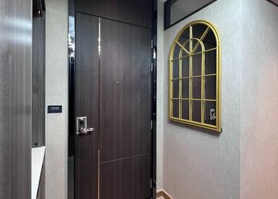 Elegant entrance hall with high-quality wooden door and modern design