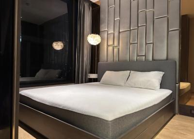 Modern bedroom with a large bed and stylish wall decor