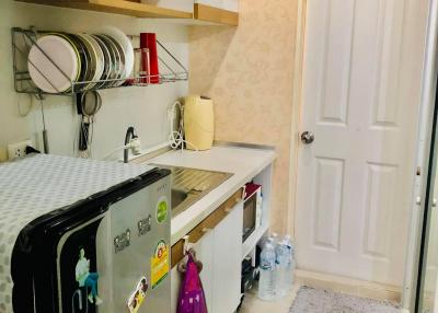 Compact kitchen with modern appliances and ample cabinet space