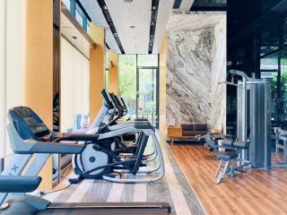 Modern gym in residential building with exercise equipment