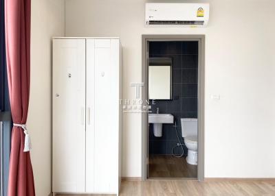 Cozy bedroom with modern air conditioning and en suite bathroom