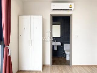Cozy bedroom with modern air conditioning and en suite bathroom