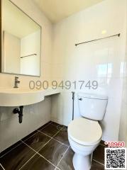 Modern bathroom interior with white ceramic fixtures
