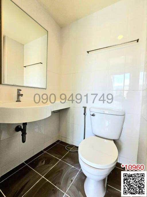 Modern bathroom interior with white ceramic fixtures