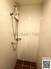 Compact bathroom shower with wall-mounted heater and handheld shower head