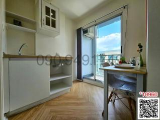 Cozy apartment kitchen with natural light and balcony access