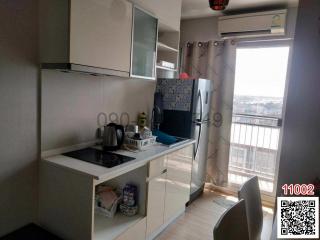 Compact fully equipped kitchen with natural light