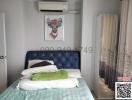 Cozy bedroom with modern decor and air conditioning unit