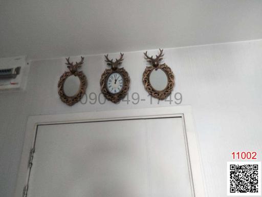 Decorative wall mirrors above a doorway