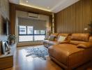 Modern living room with leather sofa and wooden accents