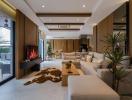 Spacious living room with modern design, natural light, and a cozy fireplace