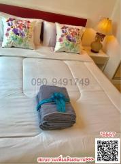 Cozy bedroom with neatly arranged bed and decorative pillows