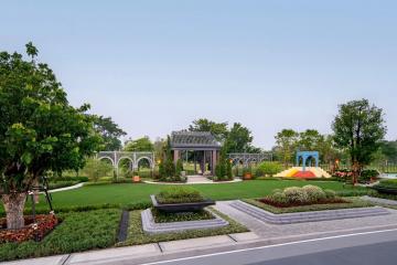 Spacious garden with gazebo and landscaped greenery