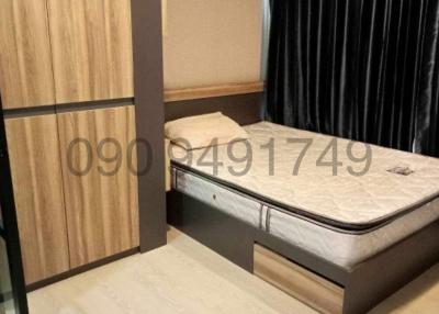 Cozy bedroom with a large bed and wooden wardrobe