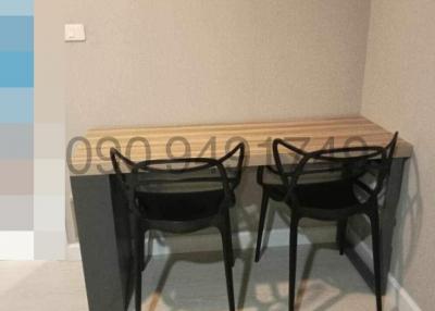 Modern small dining area with table and chairs