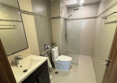 Modern bathroom with walk-in shower and vanity