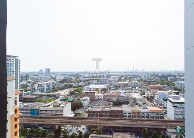 Expansive city view from a high-rise apartment balcony