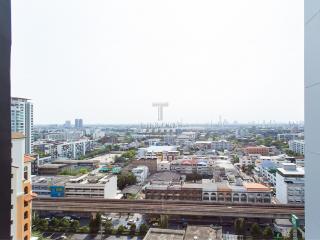 Expansive city view from a high-rise apartment balcony