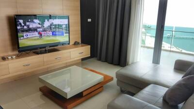 Modern living room with large window and television