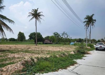 Spacious outdoor area with potential for development under a cloudy sky