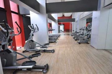 Modern gym interior with various exercise equipment