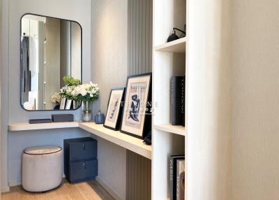 Elegantly designed bedroom interior with a vanity corner and built-in shelves