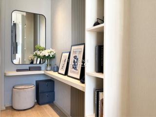 Elegantly designed bedroom interior with a vanity corner and built-in shelves