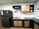 Modern kitchen with stainless steel appliances and subway tiles