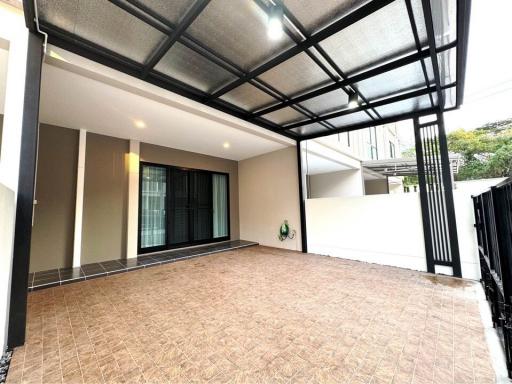 Spacious covered patio with tiled flooring and modern design