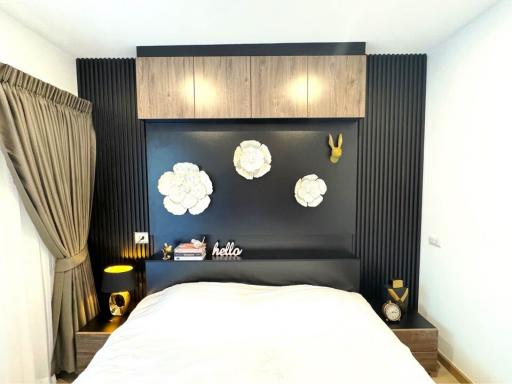 Modern bedroom with decorative wall and art pieces