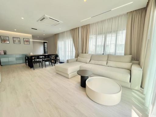 Spacious and modern open-concept living room with large sectional sofa