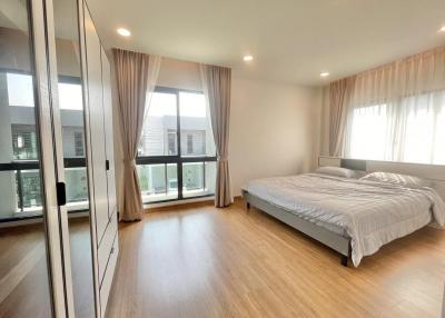 Spacious bedroom with large windows and plenty of natural light