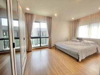 Spacious bedroom with large windows and plenty of natural light