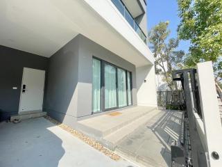 Modern building exterior with large windows and patio area