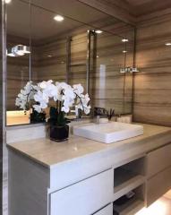 Modern bathroom with neutral color scheme and elegant fixtures