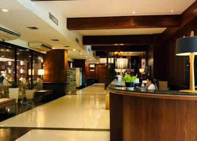 Elegant Hotel Lobby with Reception Desk and Modern Lighting
