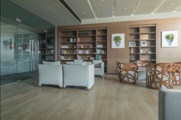 Spacious living room with modern furniture and bookshelf