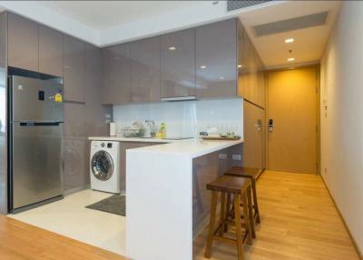 Modern kitchen with integrated appliances and breakfast bar