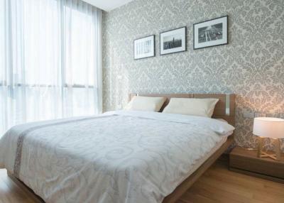 Spacious bedroom with modern design and natural light