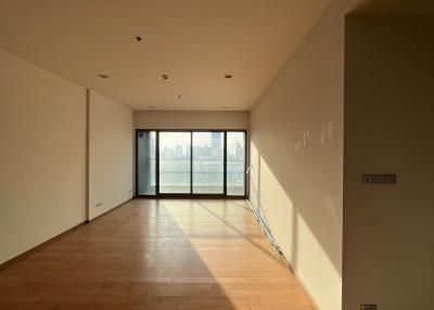 Spacious living room with natural light and hardwood floors