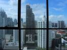 Panoramic city view from high-rise building window