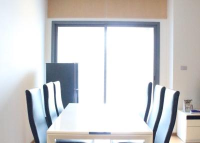 Bright dining room with a large table and chairs