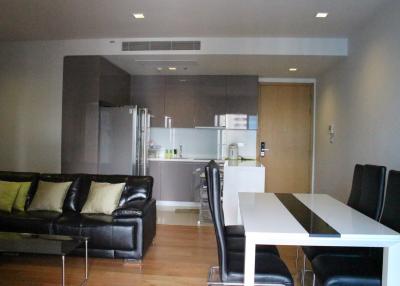 Modern open plan living room with adjacent kitchen
