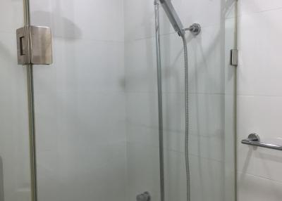 Modern glass-walled shower in a clean bathroom