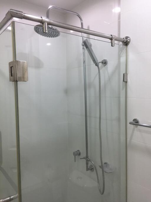 Modern glass-walled shower in a clean bathroom