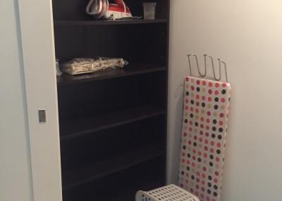 Storage room with shelving units and household items