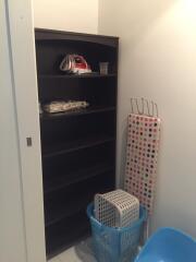 Storage room with shelving units and household items