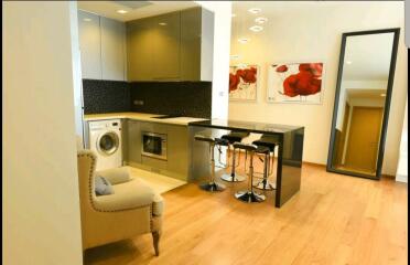 Modern kitchen with stainless steel appliances and breakfast bar